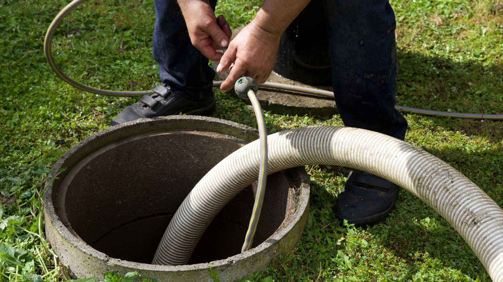 Connecting flexible hose to concrete well or septic tank opening